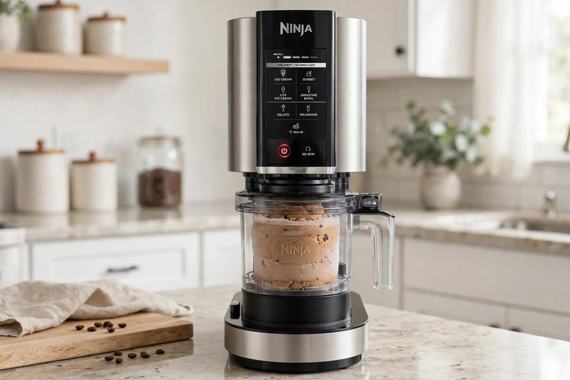 The frozen coffee crunch pint loaded into a countertop Ninja Creami machine, ready to spin